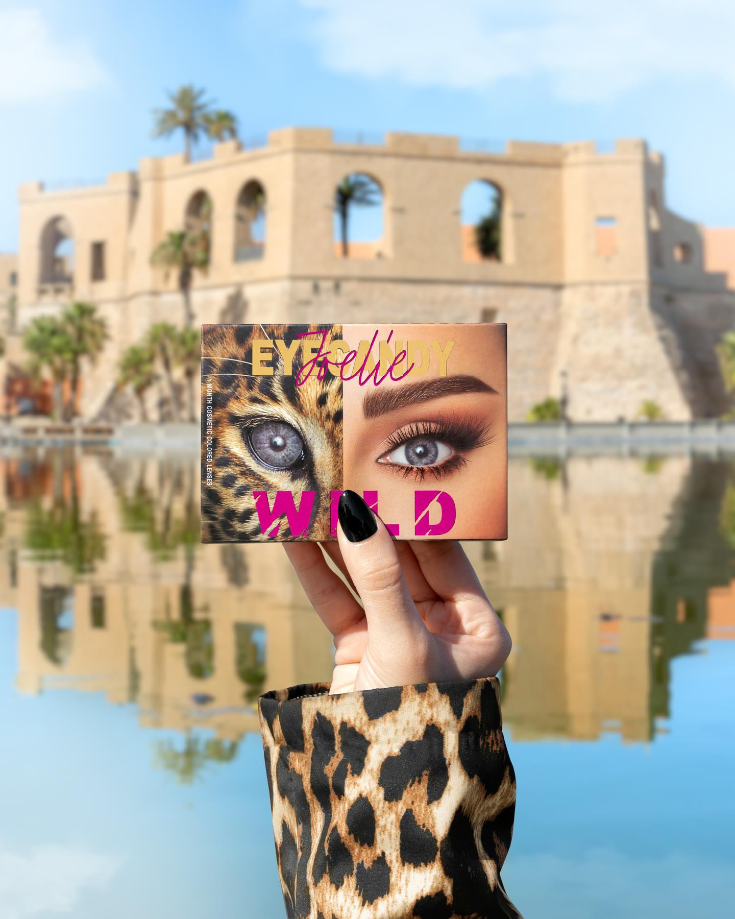 Joelle contact lenses — surreal campaign composite with a Tripoli landmark